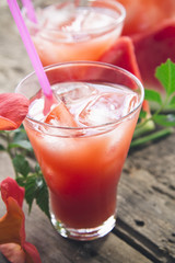 watermelon juice on wooden background