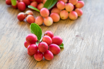 Carunda,Karonda,Carissa carandas,Apocynaceae, fruit red seed nutritious on wooden table