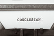 word conclusion typed on typewriter