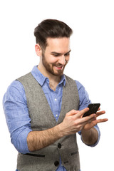  Attractive young guy looking at his smart phone while text mess
