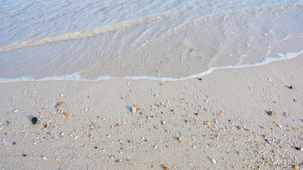 Fototapeta na wymiar Wave of the sea on the sand beach.