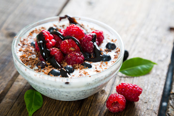 Pudding with chia seeds, fresh berries and chocolate