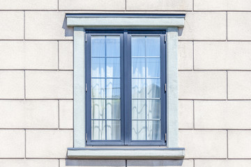 The modern window frame on white brick wall background.