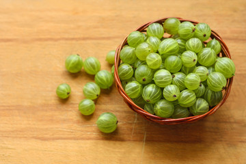 Gooseberry on a wooden surface.