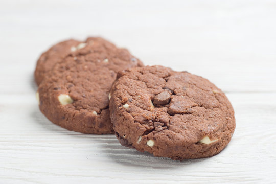 Fresh chocolate cookies on white table