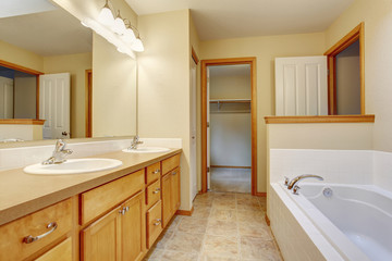 Fototapeta na wymiar Bathroom interior white bath tub, toilet and sink.