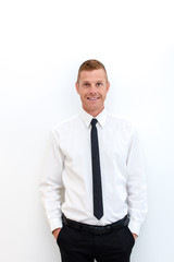 Portrait of young happy smiling business man, isolated over white background