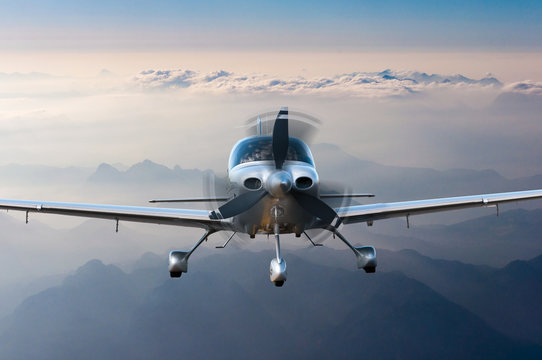 Privat Light Airplane Or Aircraft Fly On Mountain Background. VIP Travel Concept