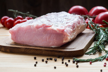 Raw pork ready to Cook on a wooden board