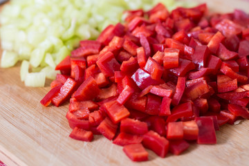 Flat lay sliced chopped red and green paprika