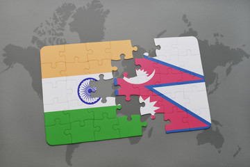 puzzle with the national flag of india and nepal on a world map background.