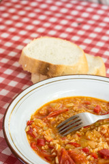 Tomato and paprika stew served on the table