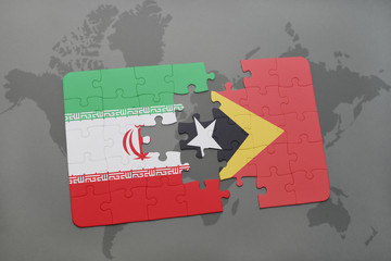 puzzle with the national flag of iran and east timor on a world map background.