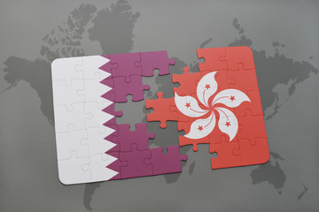 puzzle with the national flag of qatar and hong kong on a world map background.