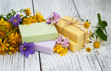 Fototapeta na wymiar herbal treatment - camomile, tutsan and soap