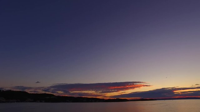 Beautiful sunset, small boats, marina, islands. Perfect evening to enjoy romantic moments.