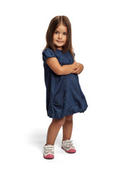 Portrait of a happy little girl on white background looking at the camera smiling