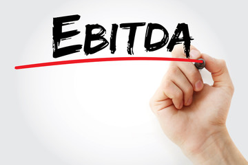 Hand writing EBITDA - Earnings Before Interest, Taxes, Depreciation and Amortization with marker, concept background