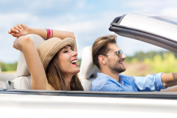 Couple enjoying a drive in a convertible
