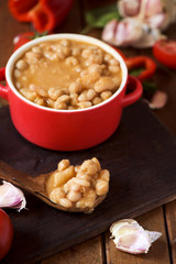 potaje de garbanzos, a spanish chickpeas stew, on a wooden table