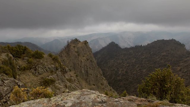 Russia, timelapse. The formation and movements of clouds up to the steep slopes of the  mountains of Central Caucasus peaks.