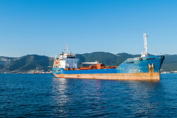 Cargo ship anchored in the roadstead Tsemes bay at the entrance of the port of Novorossiysk, Russia
