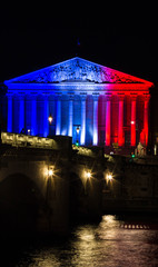 The French National Assembly lit up with the colors of French na