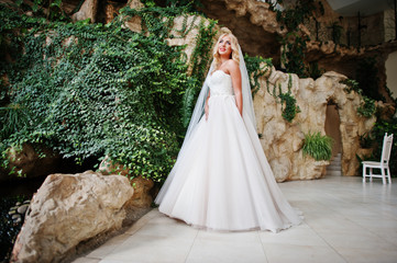 Elegant blonde blue eyes fashion bride at great wedding hall