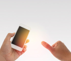 a man using hand holding the smartphone and thumb up with burst