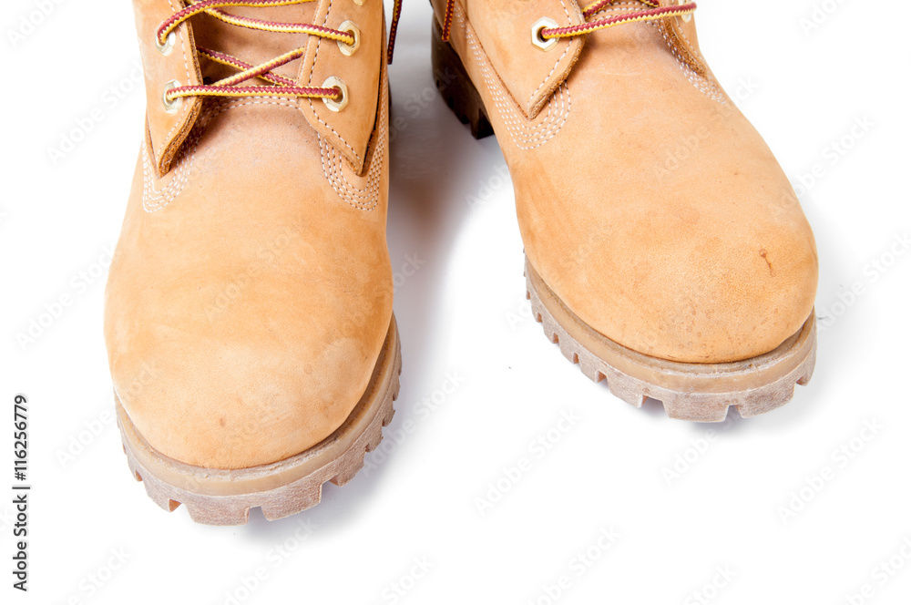 Wall mural brown leather boot isolated on white background.