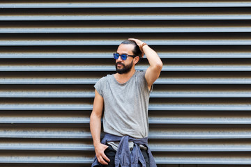 happy smiling man with beard on city street