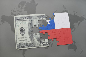 puzzle with the national flag of chile and dollar banknote on a world map background.