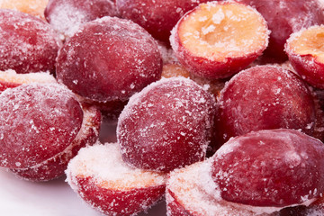 Frozen red plums