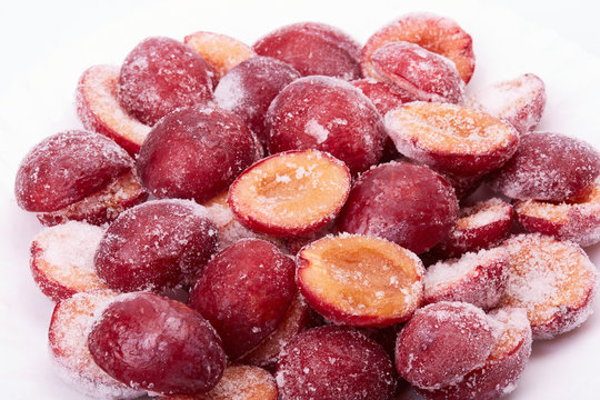 Frozen red plums