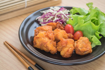 Fried chicken with vegetables on plate, Japanese style