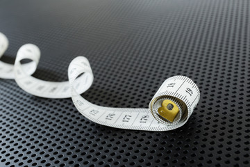Curved white measuring tape