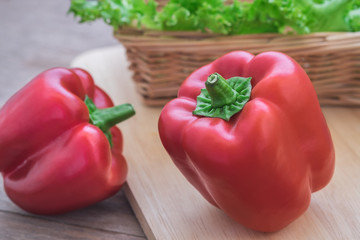 Sweet red pepper on wooden cutting board