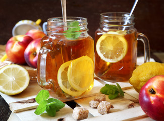 Iced tea with lemon slices and fruits