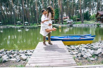 Wedding couple on a boat in the park