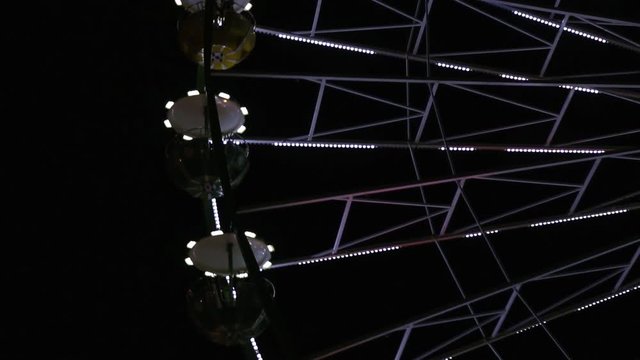 shimmering Ferris wheel in the dark