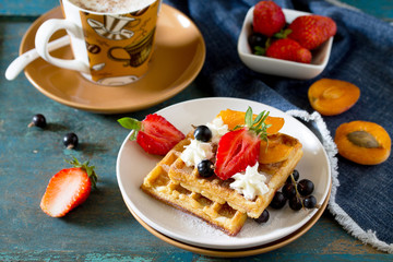 Traditional Belgian waffles with cream whipped cream and fresh b