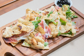 Pizza with parma ham and rockets
