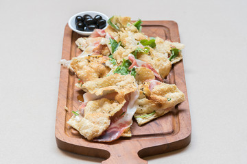 Pizza with parma ham and rockets
