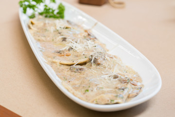 Gourmet mushroom ravioli in a creamy truffle sauce
