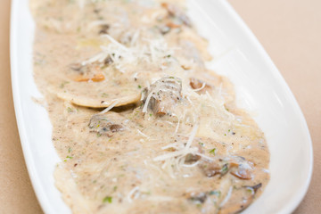 Gourmet mushroom ravioli in a creamy truffle sauce
