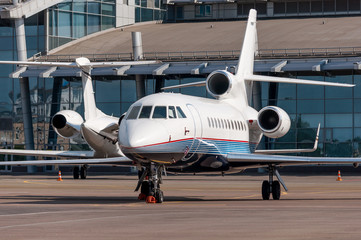 Business jet plane on the ground. Travel concept