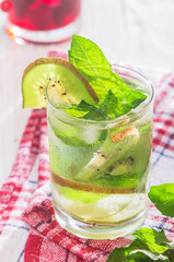 Soft drink with kiwi with ice and mint