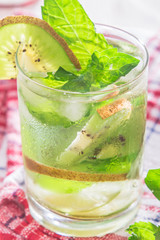 Soft drink with kiwi with ice and mint
