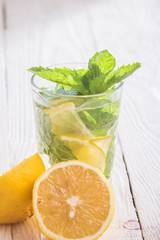 Soft drink with lemon, ice and mint