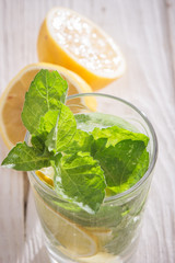Soft drink with lemon, ice and mint